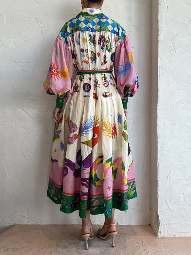 Unieke en mooie midi-jurk in shirtstijl met retroprint en lange mouwen