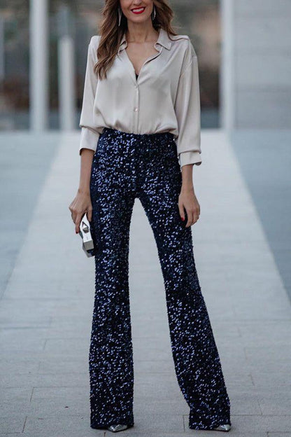 Elegante, met pailletten versierde, uitlopende broek